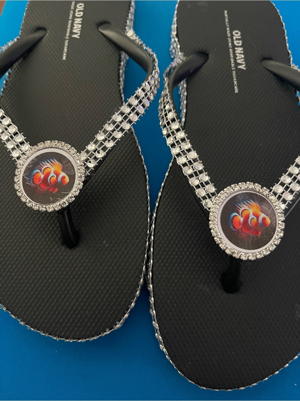 Old Navy Black Rhinestone Flip Flops with Colorful Fish Medallions